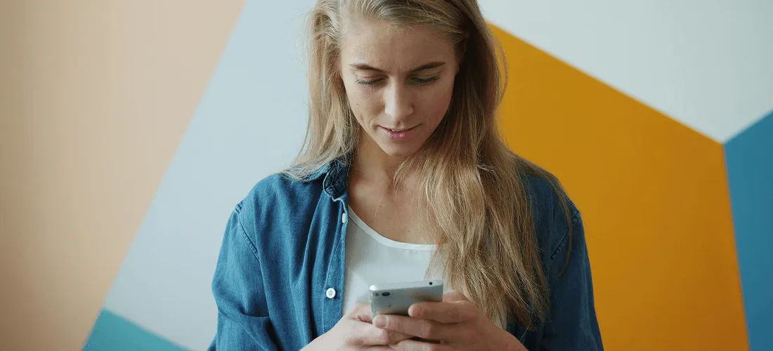 A woman viewing mood tracker apps on her phone